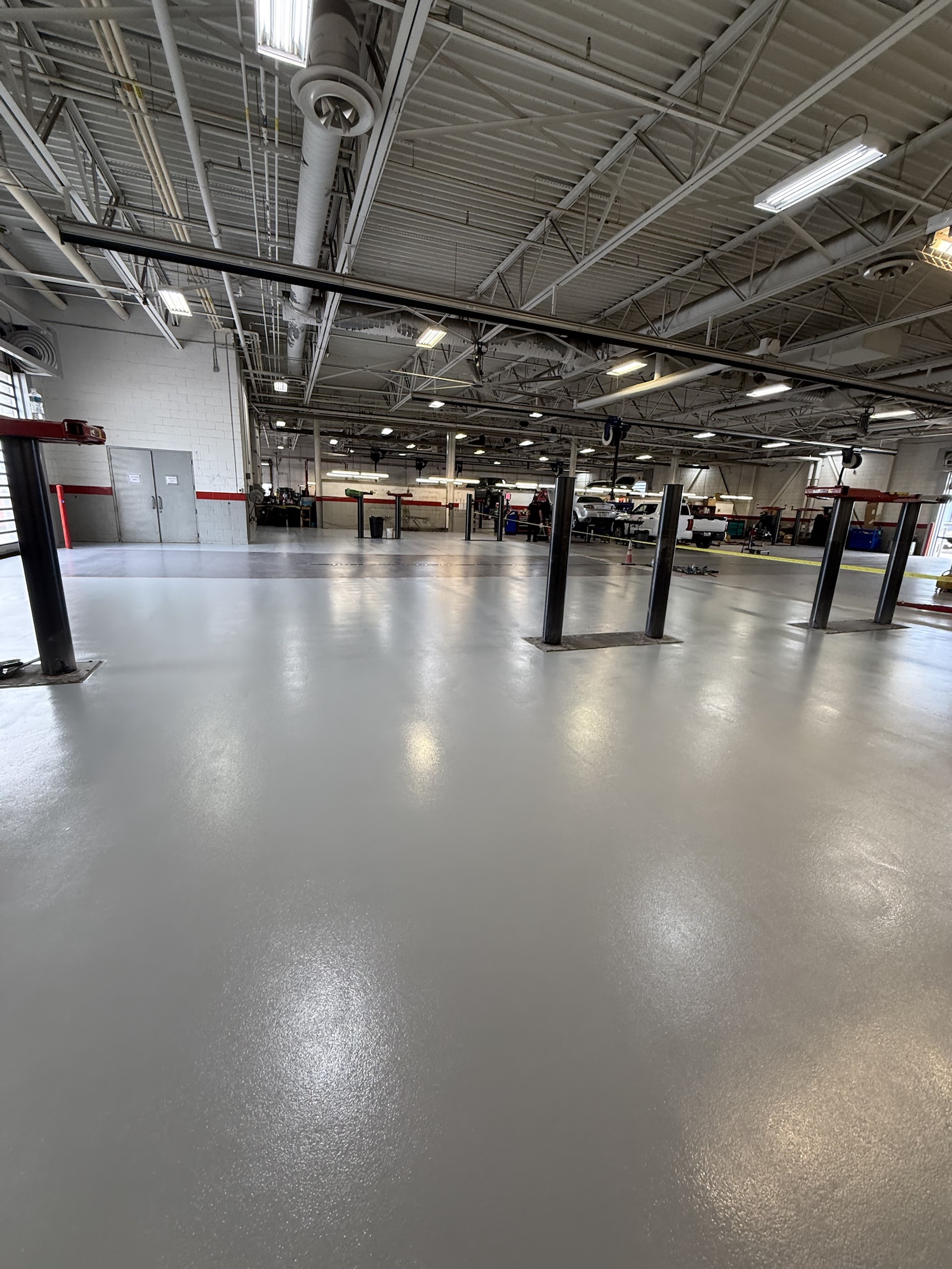 Completed gray Rezena Classic floor in a commercial service facility