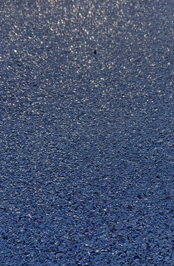 Close-up of a blue PetraX exposed-aggregate finish made with PT380